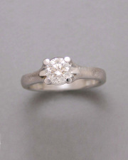 Engagement Ring 9-12: 14kt. white gold diamond engagement ring with round center diamond set in four prongs