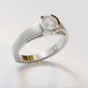 Engagement Ring 9-2: Platinum diamond engagement ring with partial bezel set round diamond and small diamonds bead set on sides