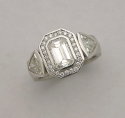 emerald-cut-halo-side-trillions-ring