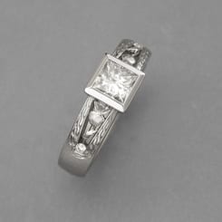 Platinum with a Princess Cut Center Diamond and thistles on each side - Boulder Jewelry - Cronin Jewelers